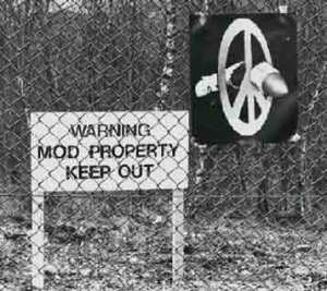 A poster of a broken missile by artist Peter Kennard, taped to the fence of Greenham Common by a protester in 1982. PeterKennard.com