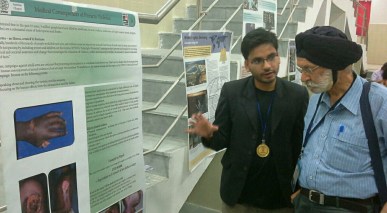 Bimal explains poster exhibition